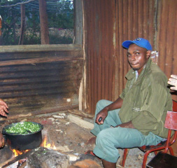 Cooking greens for the children over an open fire